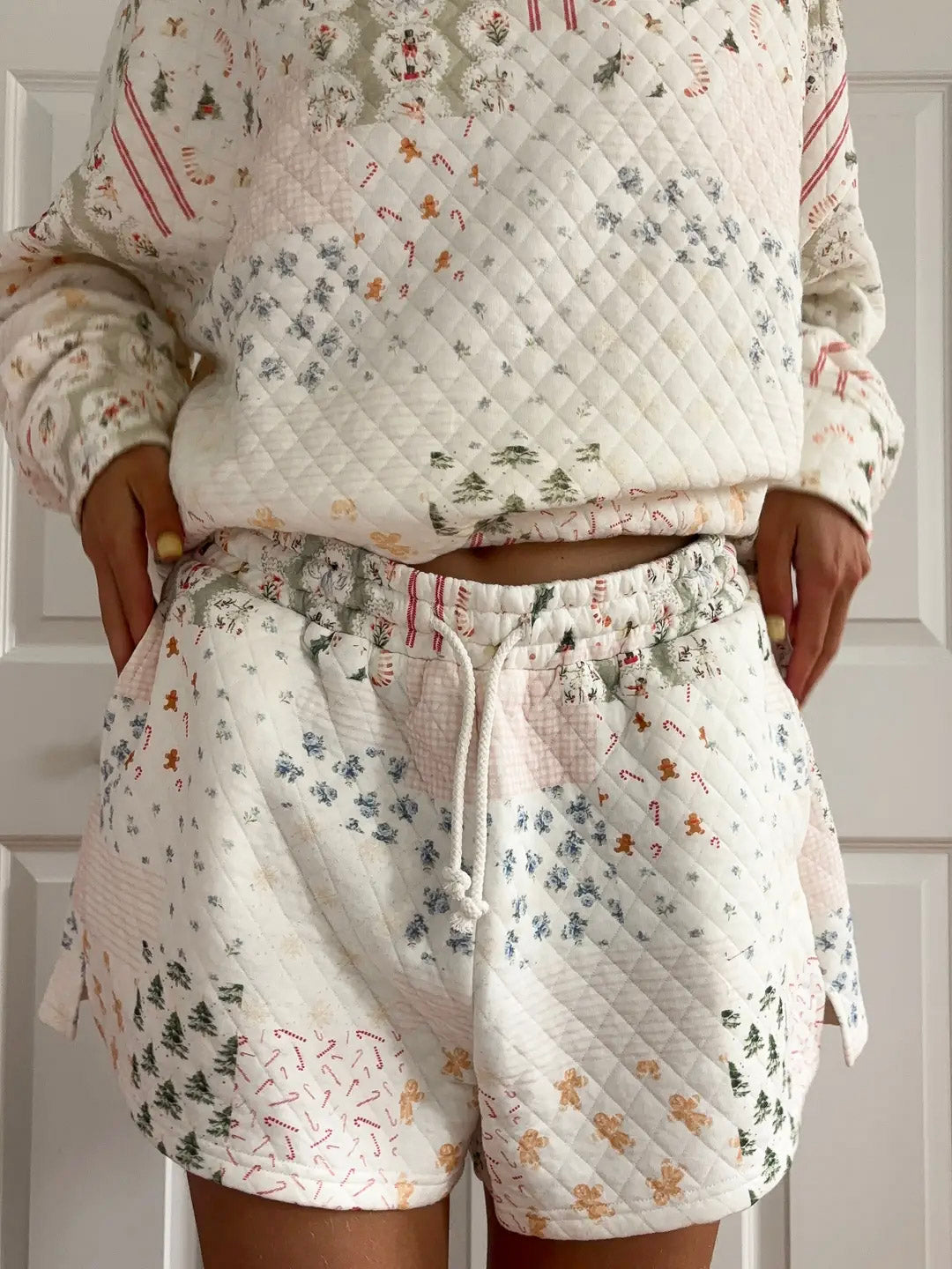 Floral-patterned pajama set with quilted design on a neutral background