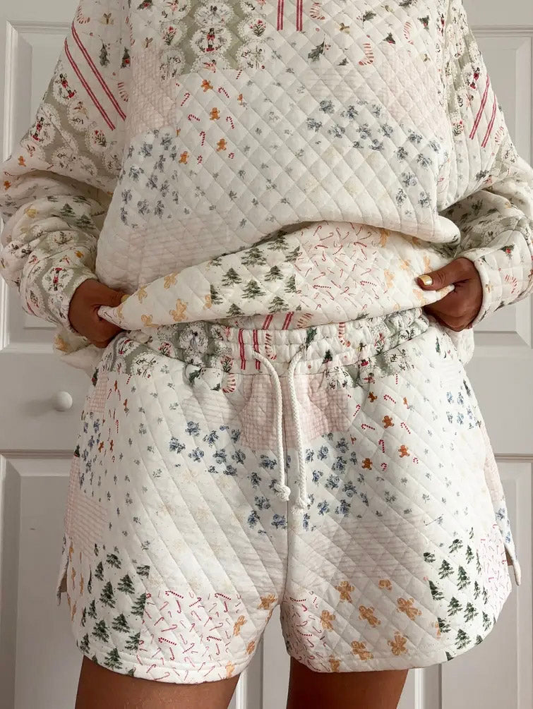 Quilted pajama set with floral and patterned design against a neutral background