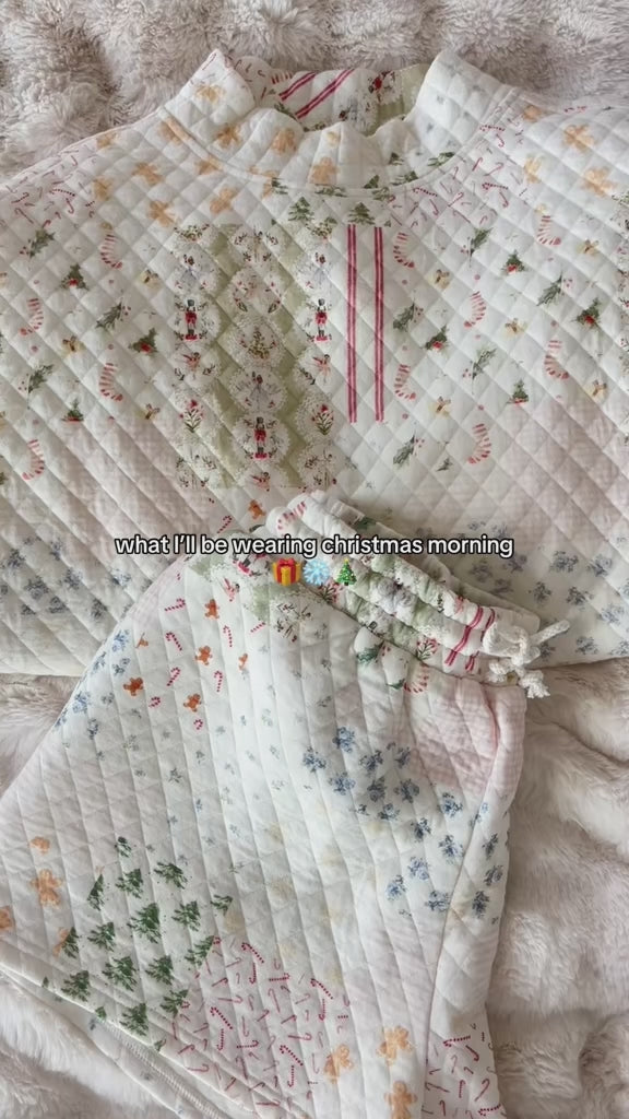 video of shorts and mockneck laying on a bed
