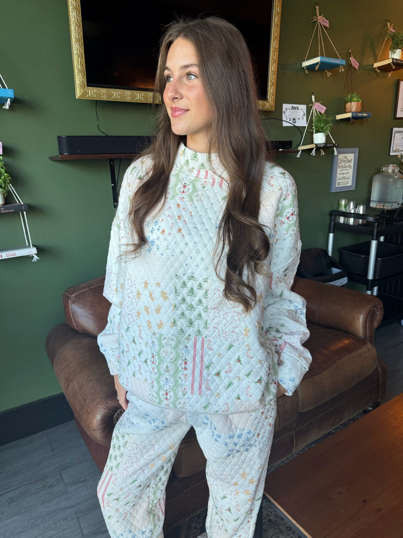 video of girl spinning in holiday quilted mockneck