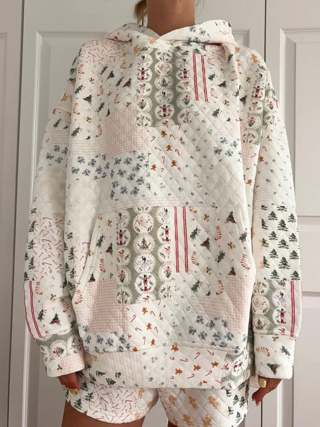 Floral patterned hoodie and shorts set against a neutral background